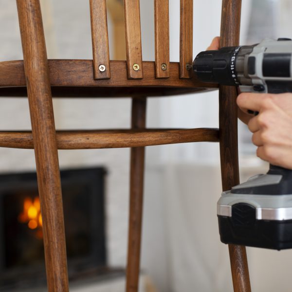 side-view-woman-restoring-wooden-furniture